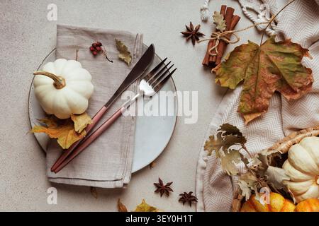 Flatlay with fall table setting and cinnamon sticks.. Stock Photo