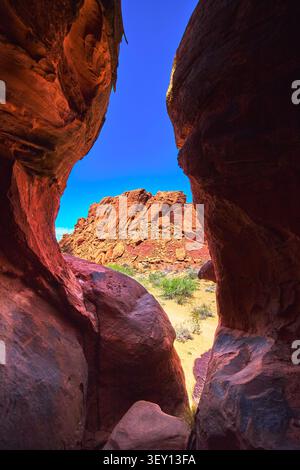 Red Rock Passage View with Sandstone Formations and Desert Vegetation Stock Photo