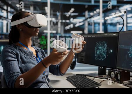 System administrator uses a VR headset in a data center to manage AI systems, train neural networks, and configure hardware. Stock Photo