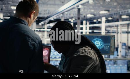 Server room specialist reacts to a critical error popup while troubleshooting AI software and infrastructure downtime. Stock Photo