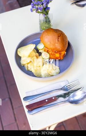 Cheeseburger and Chips Restaurant Presentation Close-Up Stock Photo