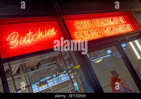 Neon Butchies sign promoting “The Best Fried Chicken in London” at the Bond Street restaurant near Ealing Broadway, west London Stock Photo