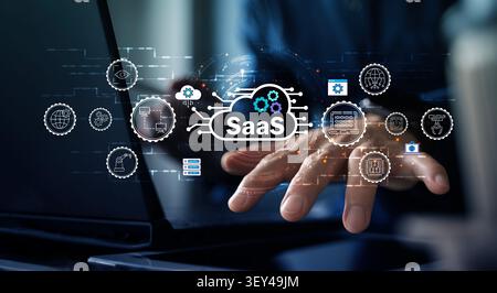 Business hand interacts with a SaaS cloud interface, showing automation, data, cybersecurity, and digital transformation for enterprise software solut Stock Photo