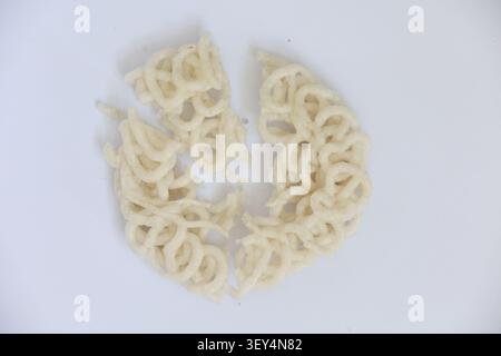 Broken Indonesian Cracker Isolated on White Background Stock Photo