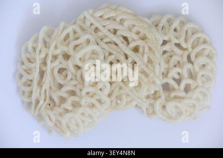 Stacked Indonesian Crackers Isolated on White Background Stock Photo