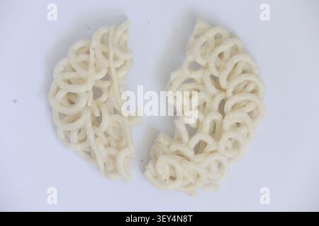 Broken Round Indonesian Cracker Split into Two Pieces on White Background Stock Photo