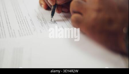 Person, hands and signing with pen on documents for registration or legal contract application. Closeup, user or client writing with paper or Stock Photo