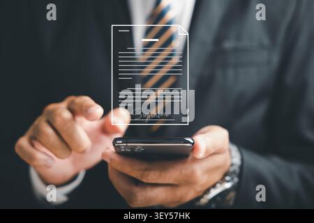 Closeup of businessman's hand using smartphone to sign digital documents on virtual screen. Showcases biometric signature technology, digital document Stock Photo