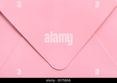 Blank pink paper closed envelope details closeup as a background Stock Photo