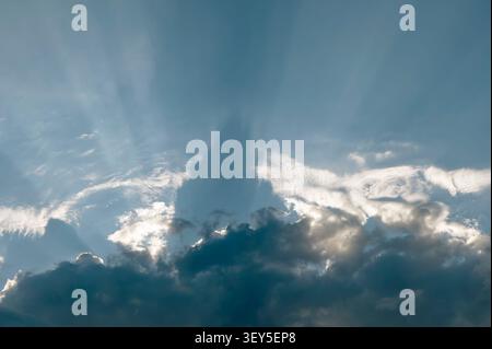 The sun is covered by black clouds bringing a summer storm Stock Photo
