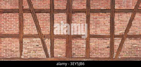 Old half-timbering panorama - brown beams with red brick infill Stock Photo