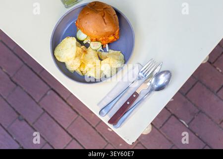 Cheeseburger and Chips Restaurant Presentation Close-Up Stock Photo