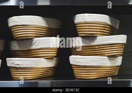 Traditional Proofing Baskets for Artisan Sourdough Bread in Bakery Stock Photo