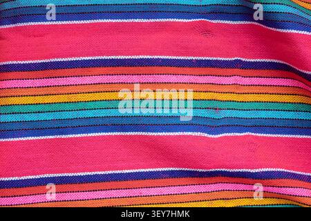 Mexican colorful striped woven textile fabric background showcasing vibrant patterns and textures Stock Photo