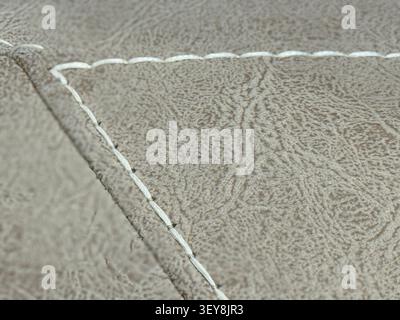 Close-up of detailed leather texture with visible stitching used as background for design or craft. Mobile photo Stock Photo