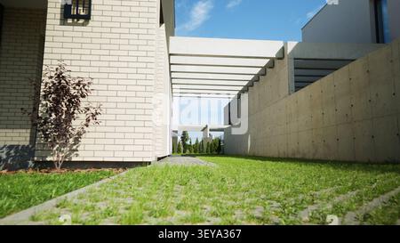 Modern residential architecture featuring concrete structures, brick facades, and green lawns creating a contemporary living space Stock Photo