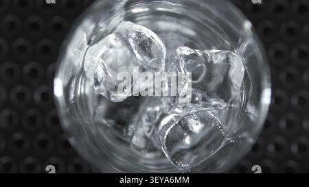 Ice cubes inside a transparent glass, symbolizing refreshment, coolness, and preparing a beverage Stock Photo