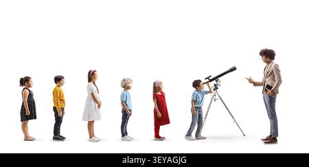 Children standing in a queue and looking through a telescope isolated on white background Stock Photo