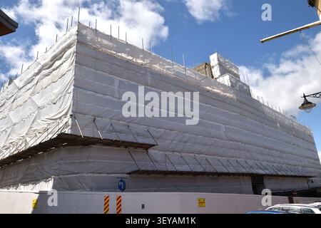 Large Construction Site Scaffold Covered with Polythene Stock Photo