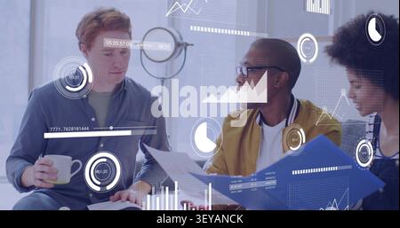 Center man sharing blue folder causing business charts overlay while colleagues reviewing approving Stock Photo