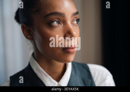 Close-up shot of thoughtful businesswoman looking away Stock Photo