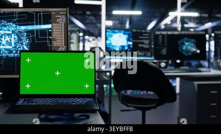 Isolated screen laptop in server room used for AI development and machine learning coding. Stock Photo