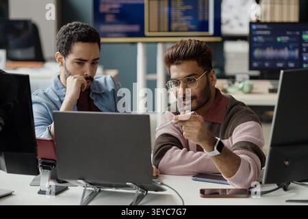 Two Adult Men Collaborating on Software Project in it Office Stock Photo