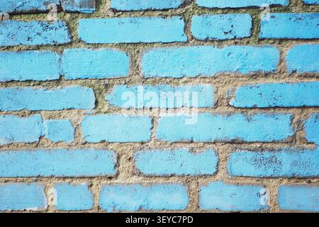 Bright blue brick wall with some texture and wear Stock Photo