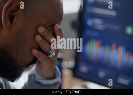 Man Analyzing Market Data on Computer in Information Office Stock Photo