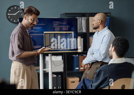 Diverse Men Discussing Software Development in Information Office Stock Photo