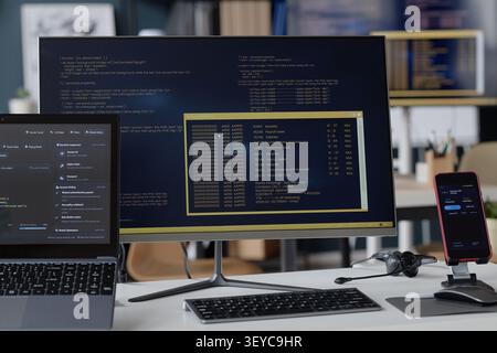 Information Technology Office Workstation Displaying Cybersecurity Data Stock Photo