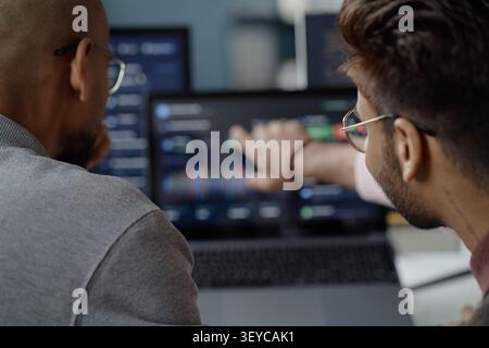 Adult Men Reviewing Data Dashboard in Information Technology Office Stock Photo