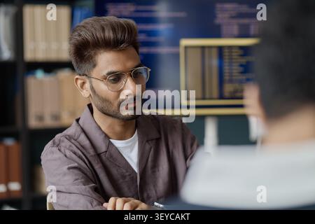 Adult Man Collaborating in Information Technology Office Stock Photo