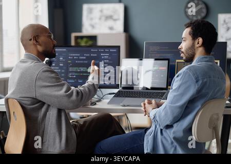 Men Discussing Software Development in Information Technology Office Stock Photo