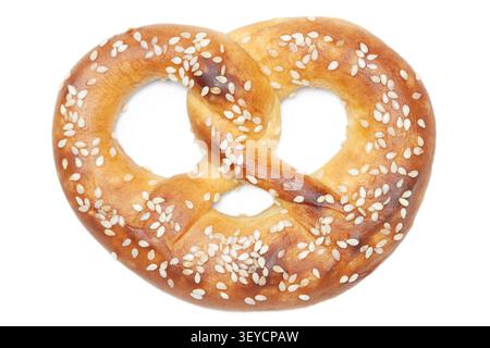 Single traditional German pretzel with sesame seeds isolated on clean white background closeup Stock Photo