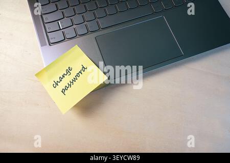 Sticky note with text change password on a laptop, protection of sensitive data from access by others, security concept, copy space, selected focus Stock Photo