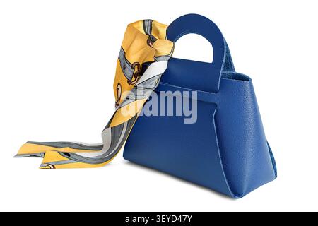 Blue leather purse with tied silk scarf isolated on white background Stock Photo