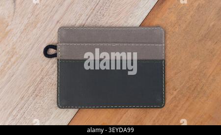 Small Leather Card Holder on Wooden Background Stock Photo