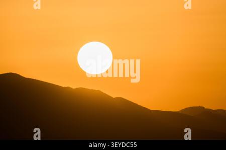 Sunset Over Mountains During Drought and Extreme Heat Stock Photo