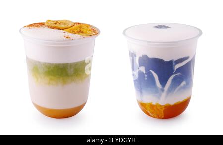 Two clear cups hold colorful desserts with layers of cream and fruit. The first has bananas on top, and the second has blue and orange layers. These treats are perfect for a summer gathering. - Photomontage Stock Photo
