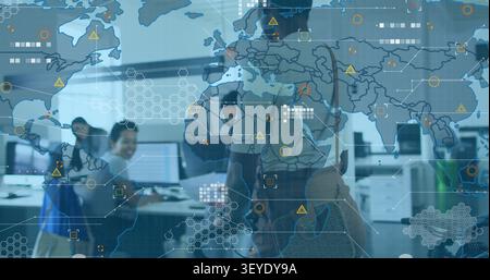 Woman entering IT office with bicycle, team sharing docs for review, map HUD overlaying screens Stock Photo