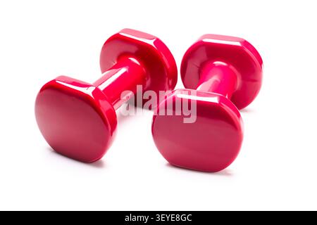 Pair of red dumbbells isolated on white background fitness balance concept Stock Photo