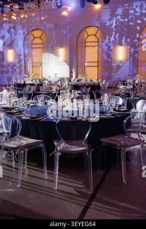 Elegant event hall bathed in warm, ambient lighting Stock Photo