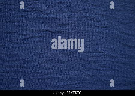 Blue textured fabric background with subtle wrinkles and woven textile detail for design use Stock Photo