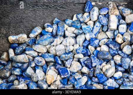 Small mineral specimens of lapis lazuli a deep blue metamorphic rock. Stock Photo
