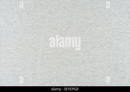 Soft light gray heathered cotton fabric shown as a seamless background texture, ideal for product mockups, web design, and textile presentations with Stock Photo