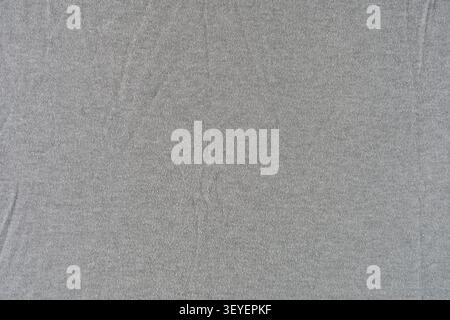 Neutral gray fabric texture with subtle wrinkles and fine weave detail, ideal as a clean seamless background for design, product photography, web layo Stock Photo