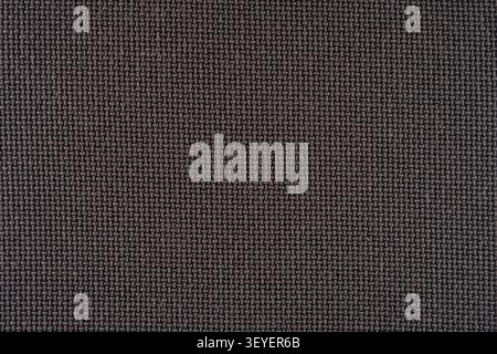 Close-up of brown woven fabric showing detailed basketweave texture ideal for backgrounds, upholstery, textile design, and surface pattern projects. N Stock Photo