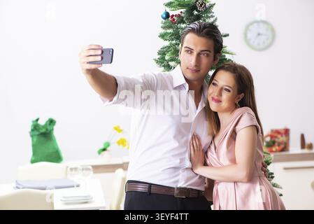 Young couple on romantic christmas date Stock Photo