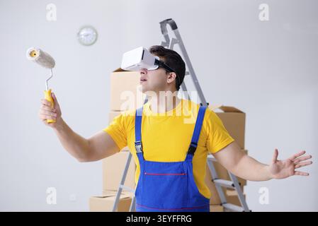 Painter contractor working with virtual reality goggles Stock Photo